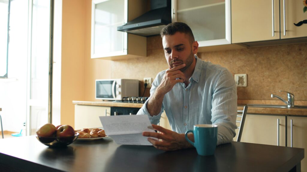 person carefully reviewing credit report to identify errors and inaccuracies for dispute