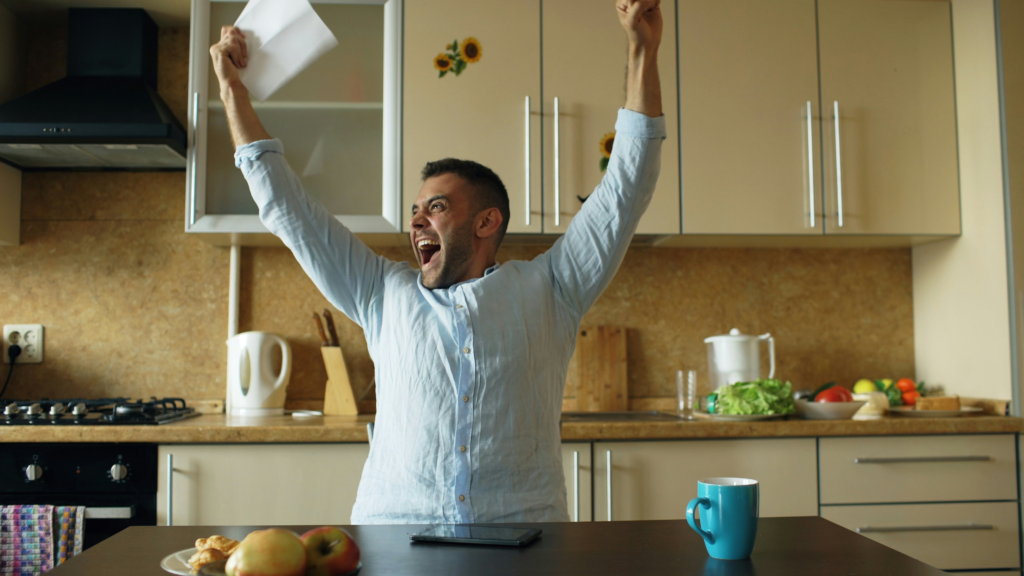 person celebrating after successfully paying off debt.webp