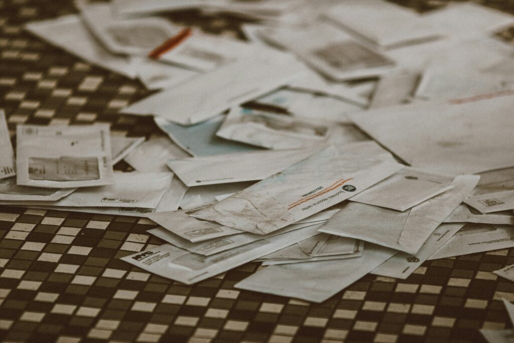 person reviewing a debt collection letter and bills v2